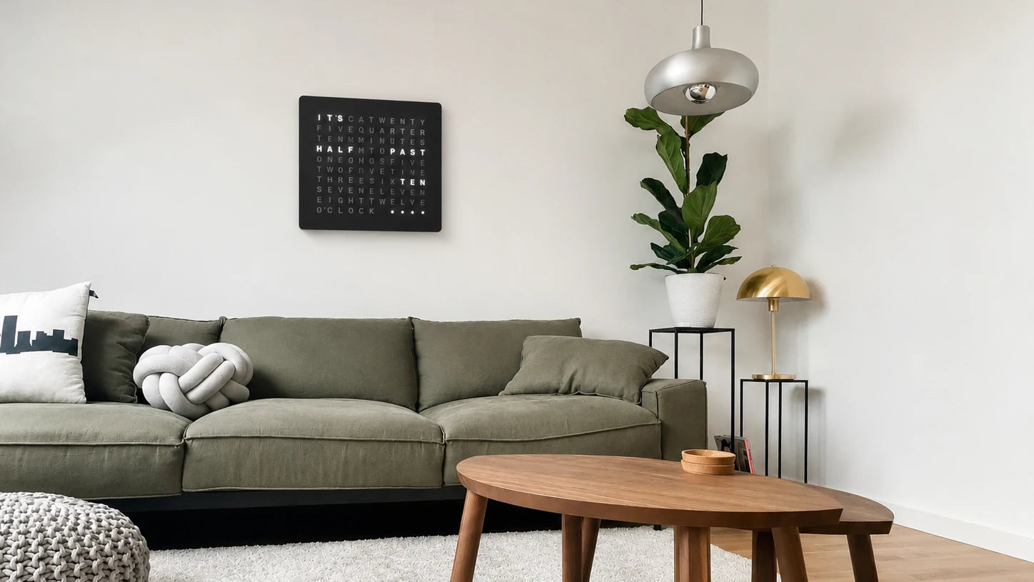 LumosClock word clock mounted on a wall in a modern kitchen and dining space